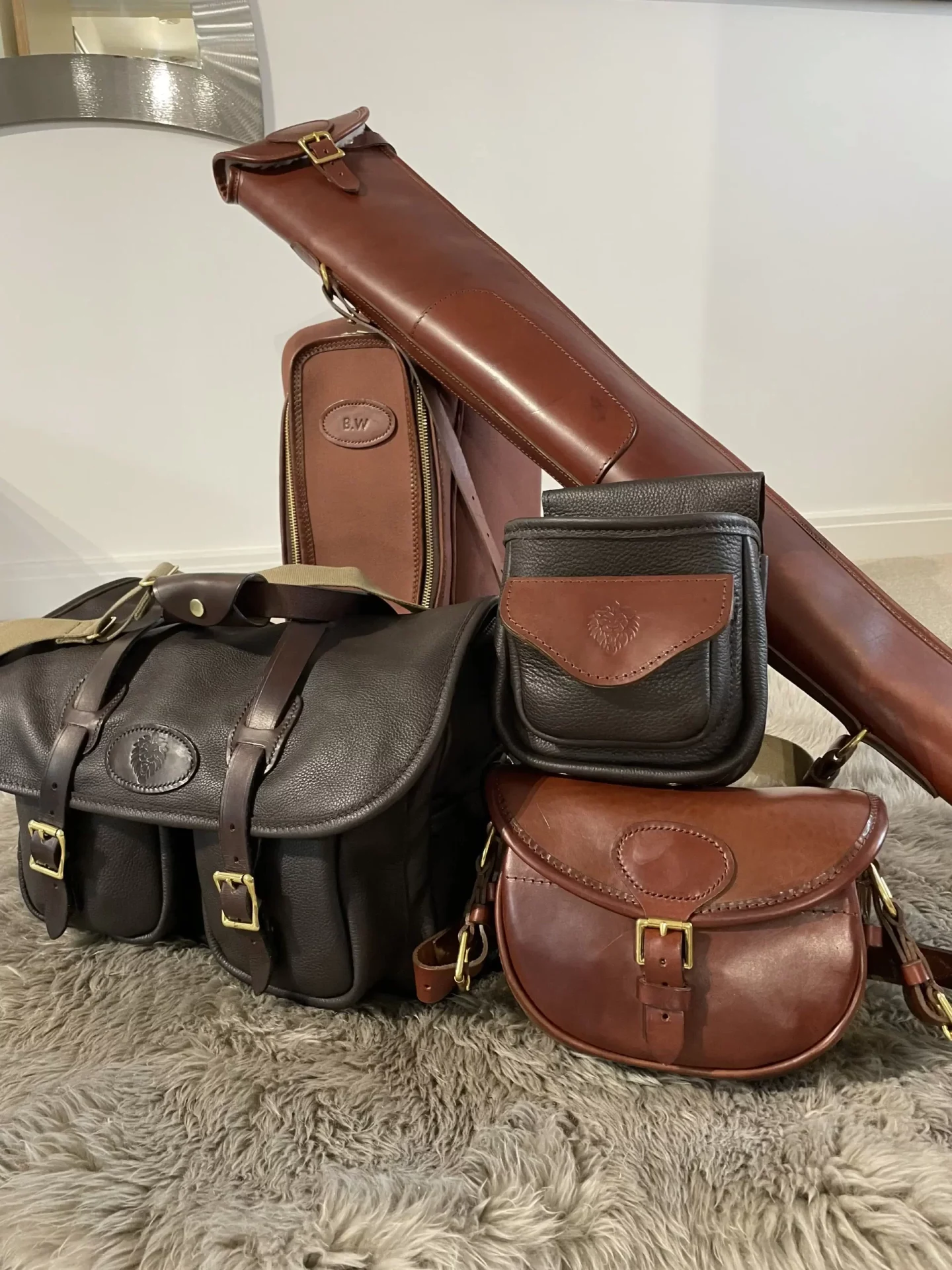 A collection of brown and black leather bags.