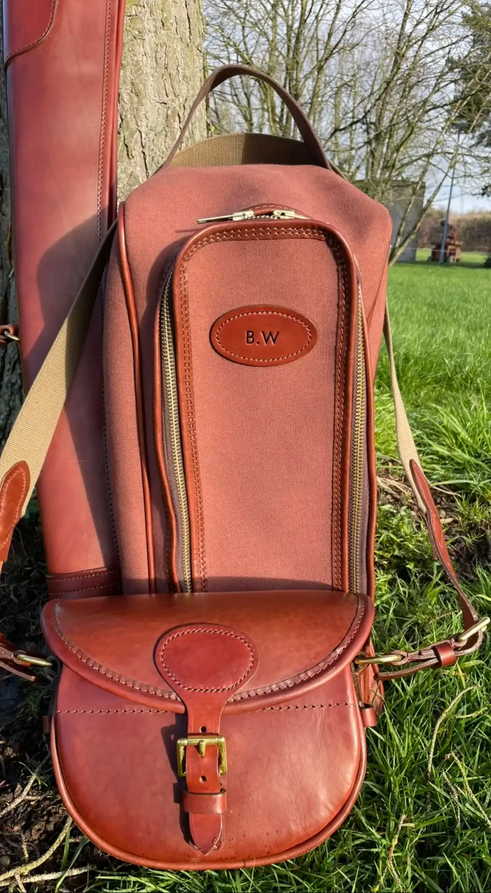 Leather sporting bags and gun slip.