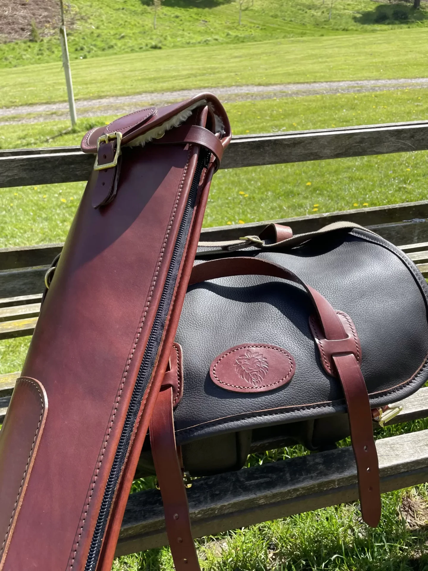 Leather bag and gun slip at the shooting ground.